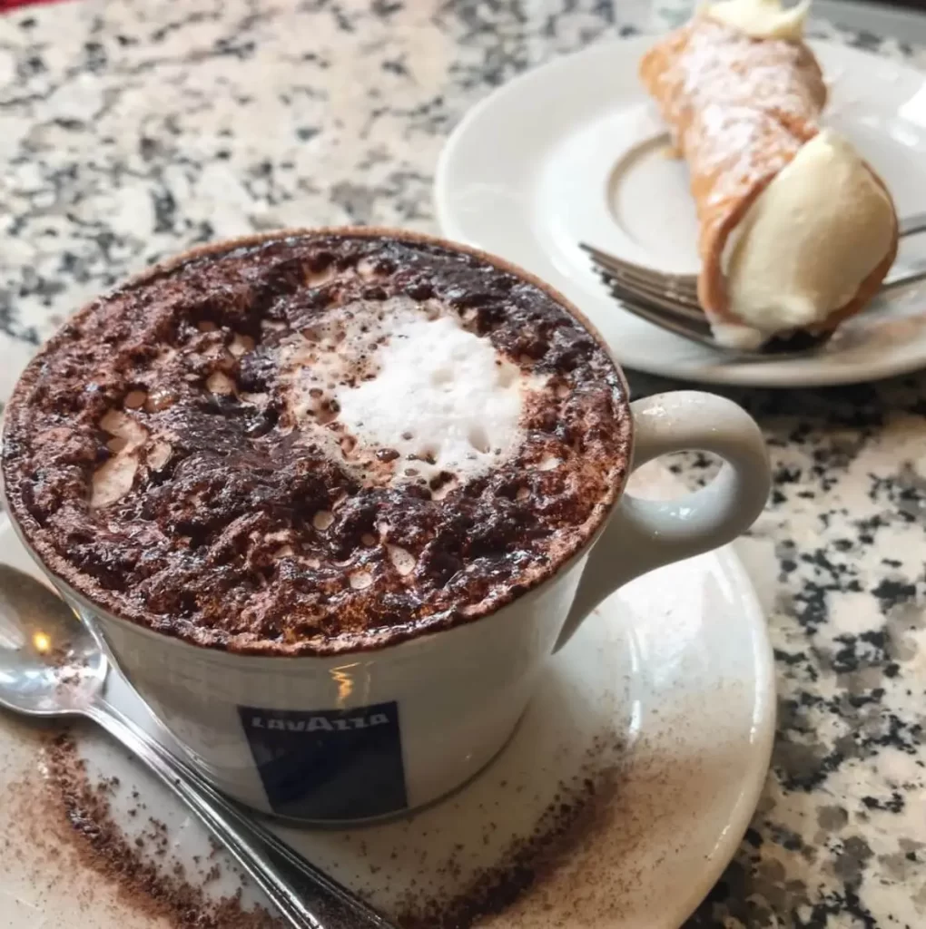 cappuccino and cannoli from Caffe Vittoria, a Boston best coffee shop