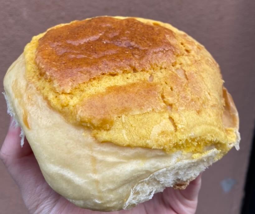 a pineapple bun from Hing Shing Pastry, a best cheap eats Boston spot